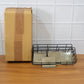 Wall storage basket installed in clean, organized kitchen space