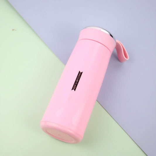 Close-up of pink glass water bottle with secure bamboo lid