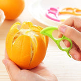 A Snail Orange Peeler with its unique ring design, ready to use for effortless citrus peeling.