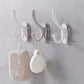 Close-up of a clear plastic self adhesive wall hook, ready for drill-free installation.