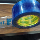 Multiple rolls of blue Flipkart packaging tape for various uses.