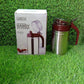 Lifestyle shot of the 500ml stainless steel oil dispenser in a modern kitchen setting.