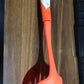 The robust nylon cooking shovel with a large scoop, ready for various culinary uses.