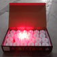 Red LED flameless tealight candles glowing warmly indoors for festive décor