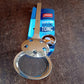 Stainless steel skimmer serving tong by Apex in use with fried snacks