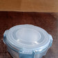 Compact 500 ml airtight food storage container held in hand
