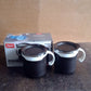 Packaging for the two-piece mocha mug set, ready for gifting.