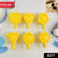 Close-up of plastic cookie cutters shaped like stars and flowers for baking