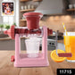 Manual juicer with vacuum lock base in use extracting fresh juice