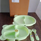 Close-up of kids mealtime feeding set highlighting colorful spoon designs