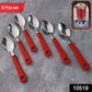 Close-up of plastic handle on baby feeding spoon in stainless steel set