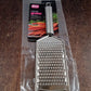 Neutral kitchen image showing stainless steel grater tool