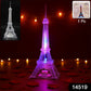 Multicolor LED Eiffel Tower night light glowing softly in a dark room