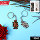 Close-up of Radha Krishna metal keychain showing intricate spiritual design in metal