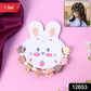 Mini hair claw clips arranged on a bunny-themed display card for kids