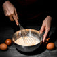 Another angle showing ergonomic handle of stainless steel whisk