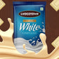 Chocotown White Compound Chocolate slab alongside various finished desserts like cupcakes.