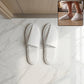 Hotel style white slippers for guest rooms