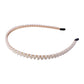 Elegant white pearl hairband, angled view showing details