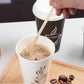 Wooden coffee stir sticks stored in a holder ready for use