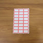 Close-up showing multiple sheets of blank writable self-adhesive shipping label stickers