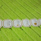 Multiple transparent adhesive hooks used to organize various items in a modern home setting.