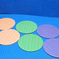 Lifestyle shot of Styleva's round silicone coasters in a modern home setting.