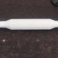 Sturdy plastic rolling pin with anti-skid base for stable operation.
