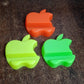 Compact apple-style mobile phone stand in assorted color variants
