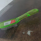 Durable scrubbing brush suitable for various household cleaning tasks.