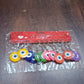 Assorted color evil eye silicone keychains laid out neatly