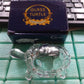 Decorative Feng Shui crystal turtle in a transparent finish, promoting peace.