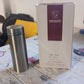 The stainless steel flask shown with its brand packaging.