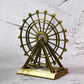 Metal desktop wheel tower ornament with intricate design on table