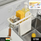 Modern kitchen sink caddy with adhesive hook, neatly storing a sponge, brush, and drying dishcloth.
