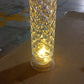 Lifestyle shot of the Crystal LED Candle illuminating a festive setting.