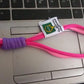 Securely attached multi-color wrist strap lanyard on a smartphone, preventing drops.