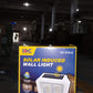 The solar panel on top of the wall lantern absorbing sunlight for charging.