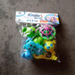 Overhead view of the 5-piece Aditi rattles baby toy collection.