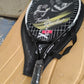 Angled studio shot of lightweight tennis racket showcasing frame design