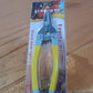 Small garden pruning snip tool in safe storage position with safety clip