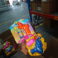 Child using elephant bubble gun toy outdoors fun play