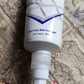 White Waterproof Tile Gap Filler being applied to a tile surface, demonstrating easy use.
