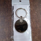 Simple black round metal keychain accessory for everyday use