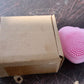 Silicone exfoliating face brush in heart shape for women.