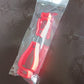 Two parts of the glove clip holder, highlighting its safety breakaway feature.