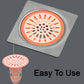 A hand demonstrating the easy installation of the insect-proof silicone floor drain stopper.