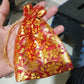 Group of net fabric gift pouches, highlighting their versatility for various items.