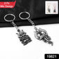 Close-up of devotional Mahakal Trishul metal keychain with detailed craftsmanship
