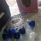 Close-up of protective charms on Om Evil Eye wind chime
